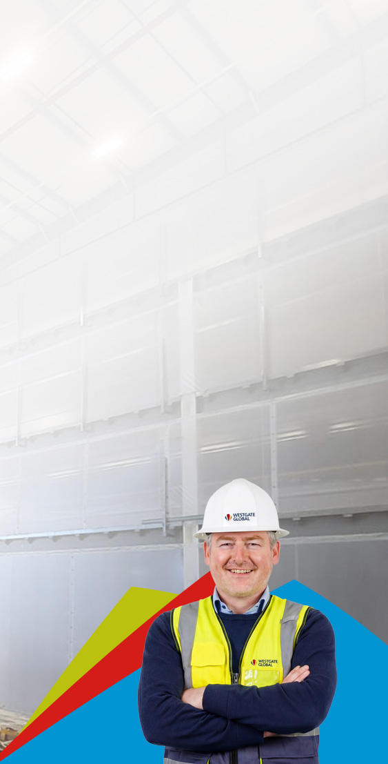 Two Engineers Talking, Walking Across Empty Factory Floor, Inspe